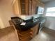 Kitchen features dark countertops and wood cabinets at 820 N Oleander Ave, Daytona Beach, FL 32118
