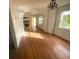Bright dining room with hardwood floors, fireplace, and arched entryway at 820 N Oleander Ave, Daytona Beach, FL 32118