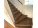 Brown carpeted staircase at 820 N Oleander Ave, Daytona Beach, FL 32118