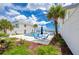 Community pool with lounge chairs and tables at 2850 Ocean Shore Blvd # 15C, Ormond Beach, FL 32176