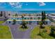 Drone view of oceanfront condos, showing garages and landscaping at 2850 Ocean Shore Blvd # 15C, Ormond Beach, FL 32176