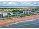 Aerial showing beachfront buildings, ocean, and surrounding neighborhood at 2850 Ocean Shore Blvd # 15C, Ormond Beach, FL 32176