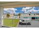 Balcony view of the community pool, parking area, and ocean at 2850 Ocean Shore Blvd # 15C, Ormond Beach, FL 32176