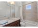 Bathroom with tub, toilet and granite vanity at 12245 Park Ave, Windermere, FL 34786