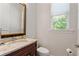 Small bathroom with granite vanity and updated fixtures at 12245 Park Ave, Windermere, FL 34786