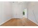 Bedroom with hardwood floors and window at 12245 Park Ave, Windermere, FL 34786