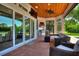 Outdoor kitchen and seating area with pool access at 12245 Park Ave, Windermere, FL 34786