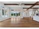Open living area showcasing hardwood floors, pool view, and sliding glass doors at 12245 Park Ave, Windermere, FL 34786