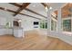 Open living space with hardwood floors and exposed wood beams at 12245 Park Ave, Windermere, FL 34786