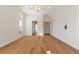 Primary bedroom with hardwood floors and double doors to closet at 12245 Park Ave, Windermere, FL 34786