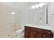 Bathroom with shower, toilet and granite vanity at 12245 Park Ave, Windermere, FL 34786
