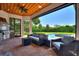 Outdoor kitchen with seating area, overlooking the pool at 12245 Park Ave, Windermere, FL 34786