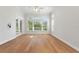 Bright bedroom with hardwood floors and multiple windows at 12245 Park Ave, Windermere, FL 34786