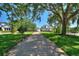 Elegant home with long driveway and lush landscaping at 12245 Park Ave, Windermere, FL 34786