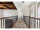 Upper level hallway with wood ceiling and tile floor at 12245 Park Ave, Windermere, FL 34786