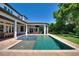 Resort-style pool and spa with expansive patio and lawn at 12245 Park Ave, Windermere, FL 34786