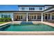 Refreshing pool and spa with patio and outdoor seating area at 12245 Park Ave, Windermere, FL 34786