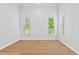 Spacious bedroom with hardwood floors and large windows at 12245 Park Ave, Windermere, FL 34786