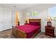 Bedroom with wooden bed frame and en-suite bath at 12245 Park Ave, Windermere, FL 34786
