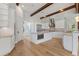Open kitchen with white cabinets, granite countertops, and stainless steel appliances at 12245 Park Ave, Windermere, FL 34786