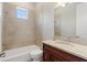 Clean bathroom with a tub, toilet, and granite vanity at 12245 Park Ave, Windermere, FL 34786
