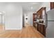 Open concept kitchen with stainless steel appliances and wood cabinets at 12245 Park Ave, Windermere, FL 34786