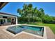 Spacious pool and spa with patio and lush landscaping at 12245 Park Ave, Windermere, FL 34786