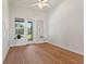 Spacious bedroom with hardwood floors and access to the backyard at 12245 Park Ave, Windermere, FL 34786