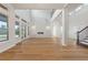 Open concept living room with hardwood floors and fireplace at 12245 Park Ave, Windermere, FL 34786