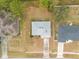 Aerial view of a home with a gray roof and a driveway at 3186 Newhope Dr, Deltona, FL 32738