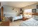 Bedroom with twin beds, wicker furniture, and animal-themed art at 3170 Ocean Shore Blvd # 305, Ormond Beach, FL 32176