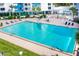 Inviting rectangular pool with surrounding lounge chairs at 935 N Halifax Ave # 907, Daytona Beach, FL 32118