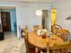 Dining area with wood table and chairs at 935 N Halifax Ave # 907, Daytona Beach, FL 32118