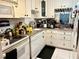 Bright kitchen with white cabinets and appliances at 935 N Halifax Ave # 907, Daytona Beach, FL 32118