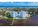 Aerial view of waterfront property with pool, showcasing the surrounding area at 935 N Halifax Ave # 907, Daytona Beach, FL 32118