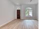 Bright and airy living room with hardwood floors and large windows at 260 Spreading Oak Ln, Ormond Beach, FL 32174