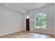 Bright and airy living room with hardwood floors and large windows at 260 Spreading Oak Ln, Ormond Beach, FL 32174