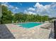 Relaxing community pool with plenty of lounge chairs at 1743 Red Rock Rd, New Smyrna Beach, FL 32168
