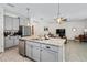 Modern kitchen with an island, stainless steel appliances, and granite countertops at 1743 Red Rock Rd, New Smyrna Beach, FL 32168