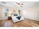 Main bedroom with wood floors and ceiling fan at 108 Oak Haven Cir, Deland, FL 32720