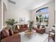 Cozy living room featuring brown leather sofas and a wood coffee table at 108 Oak Haven Cir, Deland, FL 32720