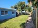 View of the backyard with grassy area and wooden fence at 10 Juniper Dr, Ormond Beach, FL 32176