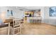 Light-filled dining area with wood flooring and kitchen access at 231 Riverside Dr # 1904, Daytona Beach, FL 32117