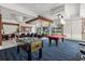 Game room with foosball, pool table, and seating at 231 Riverside Dr # 1904, Daytona Beach, FL 32117