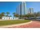 Luxury high rise building with palm trees and landscaping at 231 Riverside Dr # 1904, Daytona Beach, FL 32117
