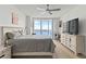 Bedroom with water views, king bed, and large TV at 231 Riverside Dr # 1904, Daytona Beach, FL 32117