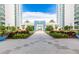 Building entrance with landscaped walkway at 231 Riverside Dr # 1904, Daytona Beach, FL 32117