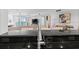 Kitchen with a breakfast bar overlooking the living area at 231 Riverside Dr # 1904, Daytona Beach, FL 32117