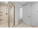 Shower with glass enclosure and neutral tile at 231 Riverside Dr # 1904, Daytona Beach, FL 32117