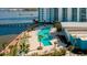 Luxury waterfront pool area with palm trees and lounge chairs at 231 Riverside Dr # 1904, Daytona Beach, FL 32117